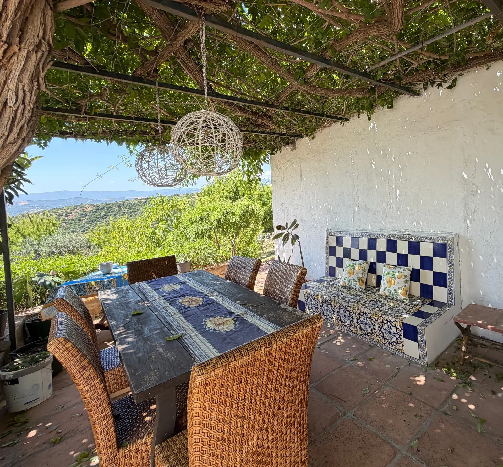 The Finca's restored patio, dappled in afternoon light