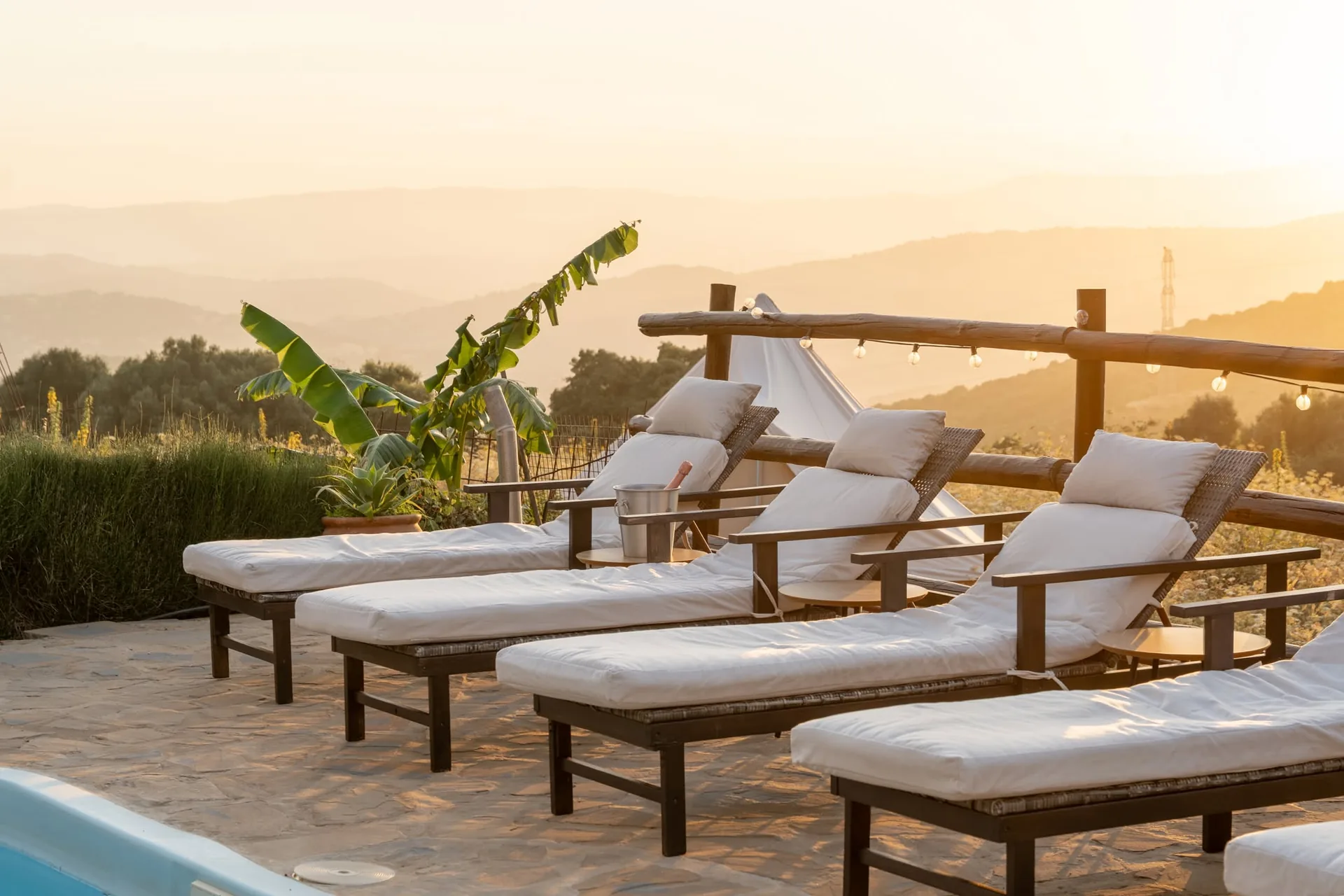 The villa's pool and terrace at dusk